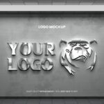 Realistic Glass PSD Logo Mockup on Wall